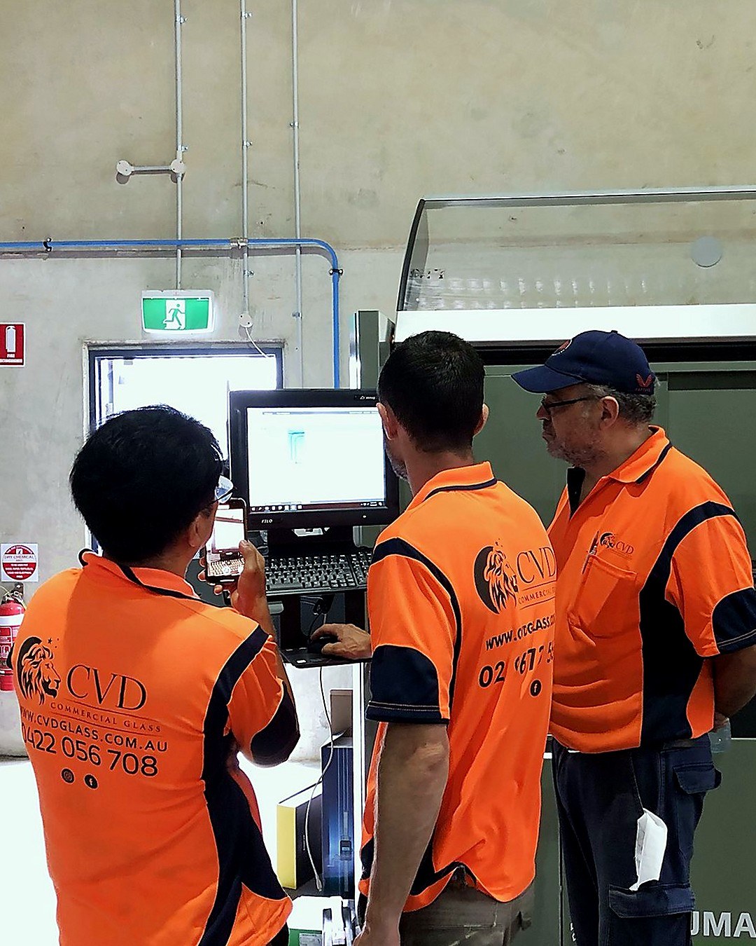 The CVD Commercial Glass team training on their Emmegi Phantomatic M3 CNC